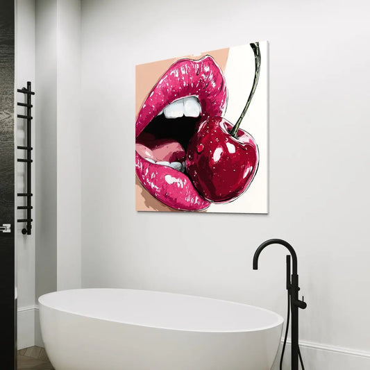 Bathroom with a canvas print of pink lips and a cherry on the wall above a white bathtub.