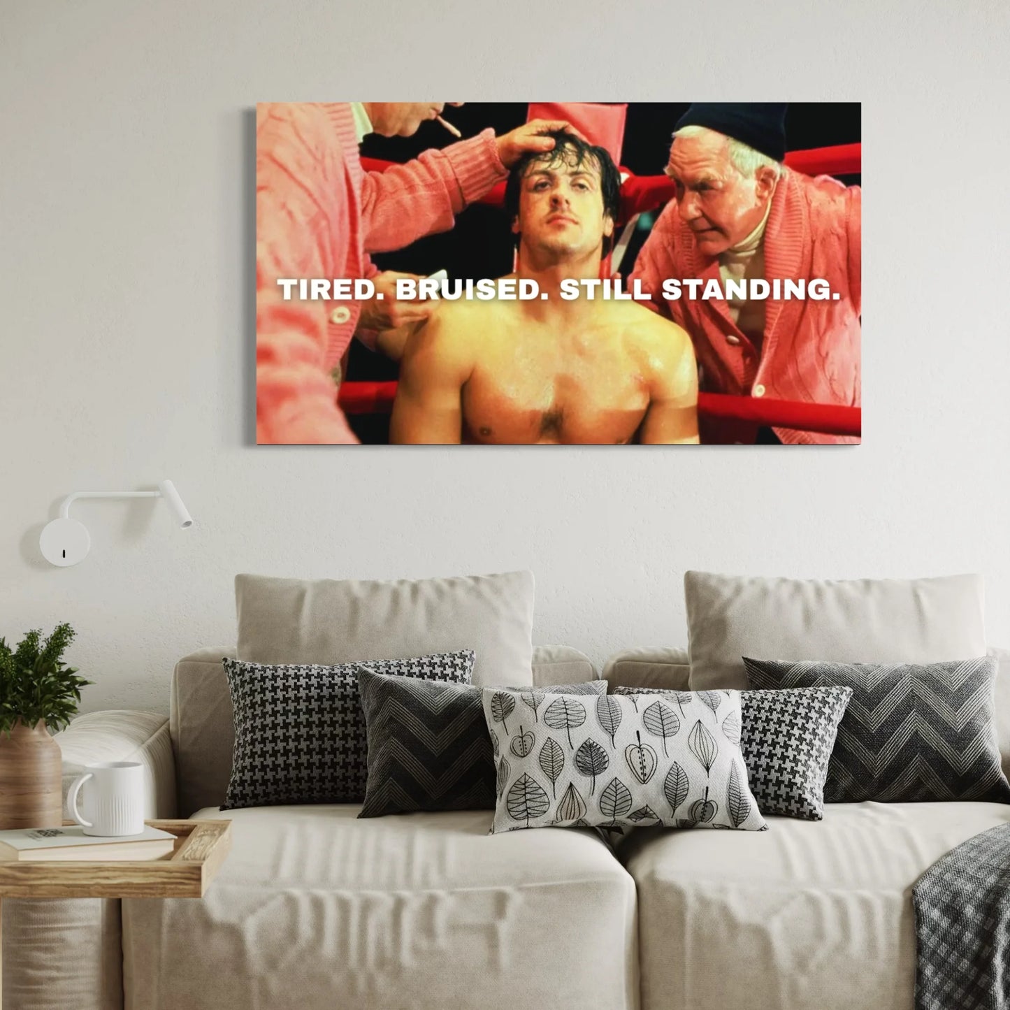 Rocky Balboa motivational wall art with text “Tired. Bruised. Still Standing.”