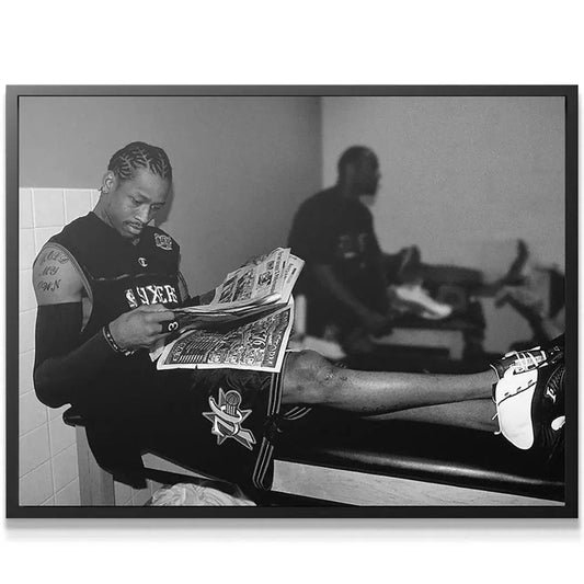 Close-up on face: Detailed black and white close-up of Allen Iverson focusing intensely on the newspaper, part of the 'Allen Iverson - Headlines' series.