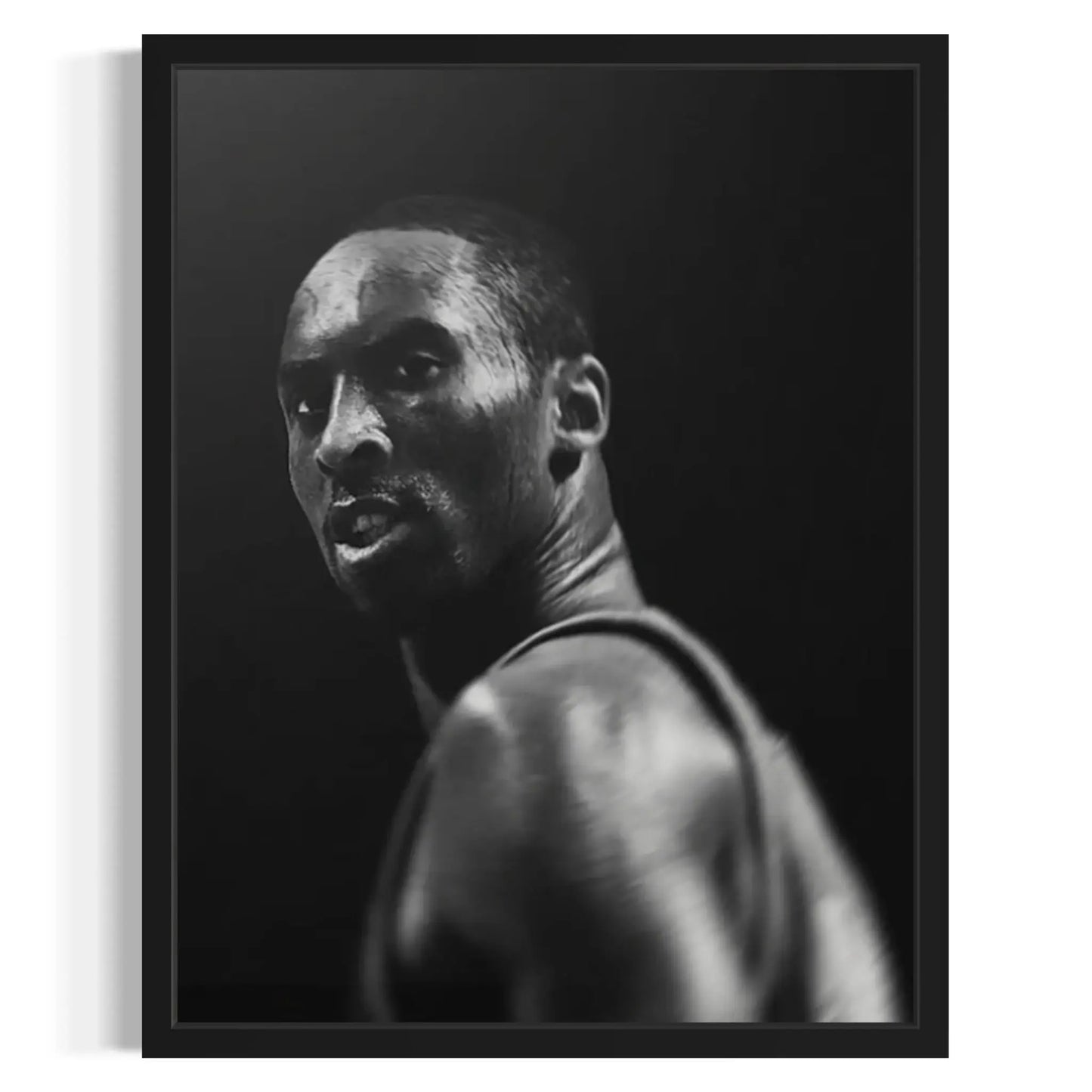 Black and white portrait of a person against a dark background