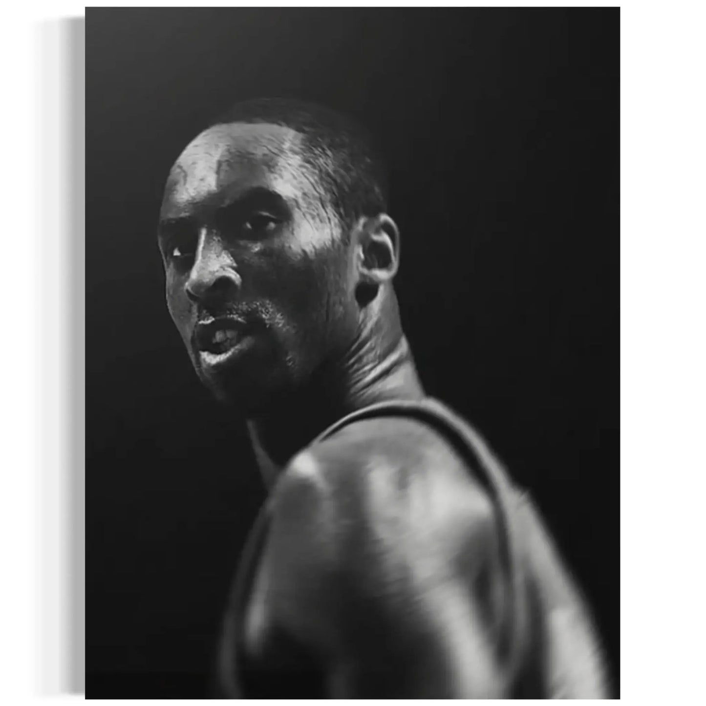 Black and white portrait of a person against a dark background