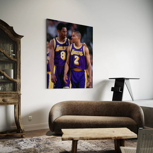 Framed wall art of Kobe Bryant and Derek Fisher from the Lakers in purple jerseys.