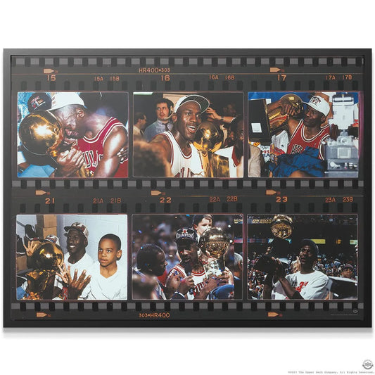 Detailed view of the Michael Jordan - Film Strip focusing on MJ embracing the golden championship trophy in the first frame.