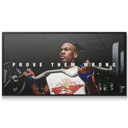 Motivational lifestyle shot of the canvas artwork 'Michael Jordan - Prove Them Wrong' displayed in a modern gym setting.