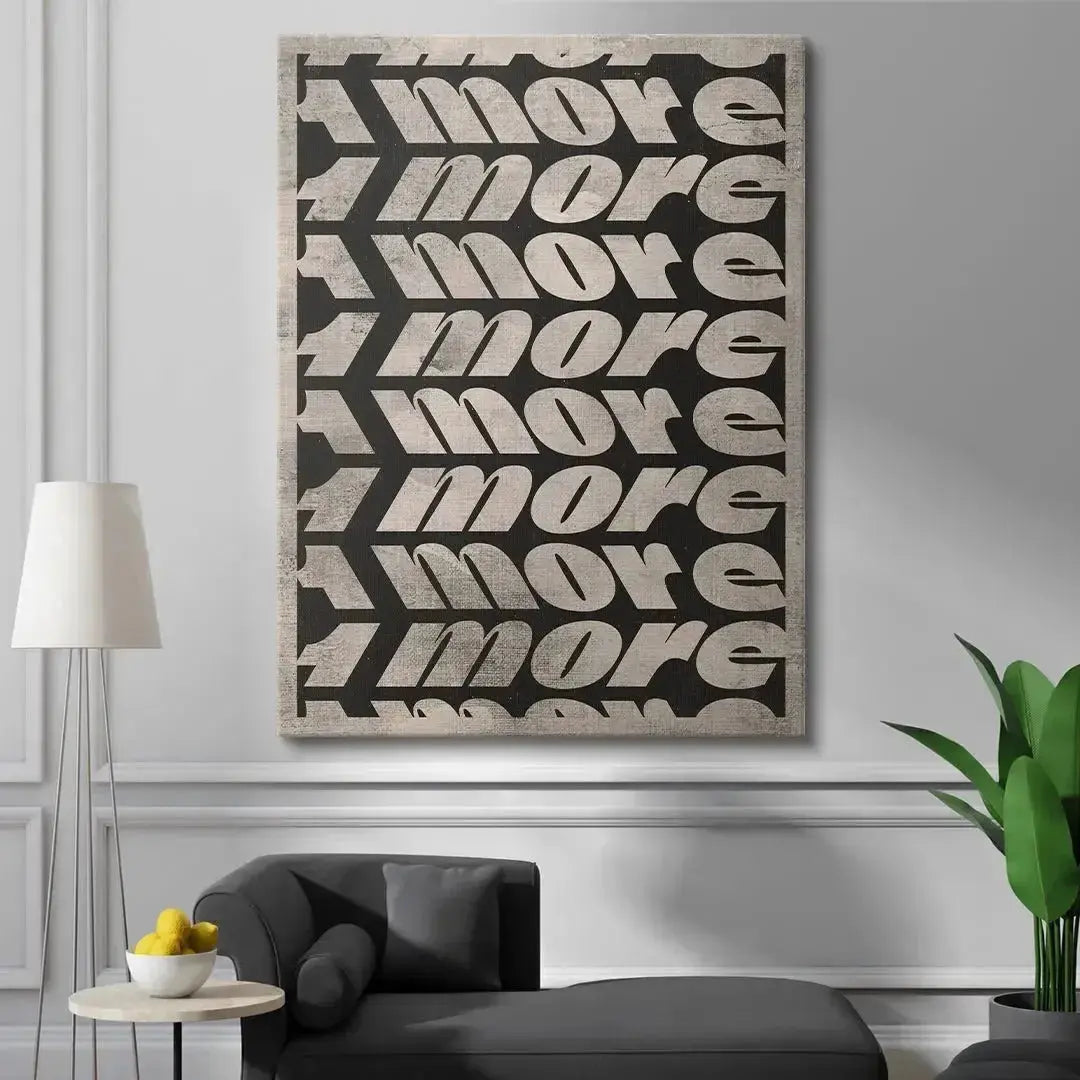 Lifestyle context: '1 More' print mounted above a minimalist sofa in a bright, modern loft apartment setting.