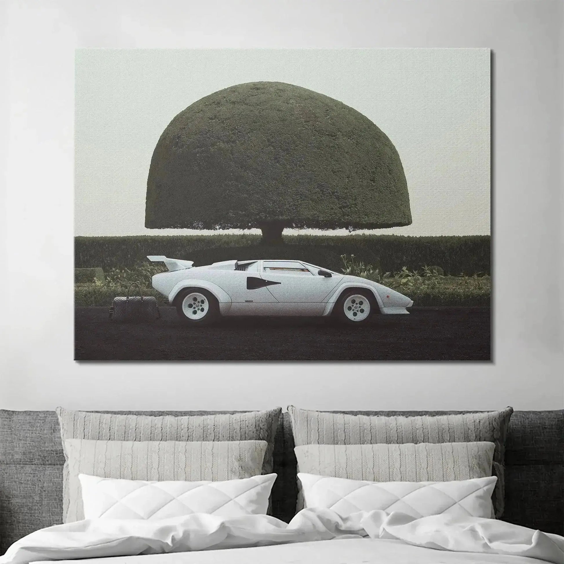 Moody texture detail of the dark ground contrasting with the bright white car in '6 am In Hamptons'.