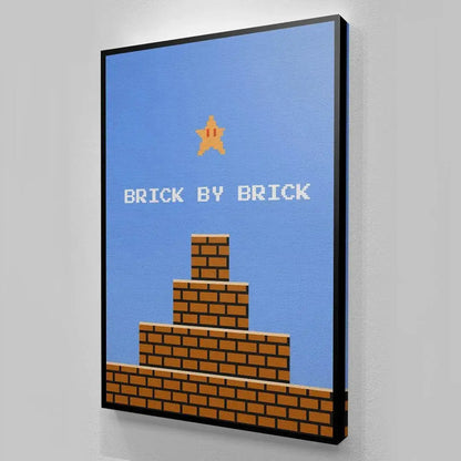 Corner perspective highlighting the sleek black frame surrounding the classic '8bit Brick By Brick' poster design.