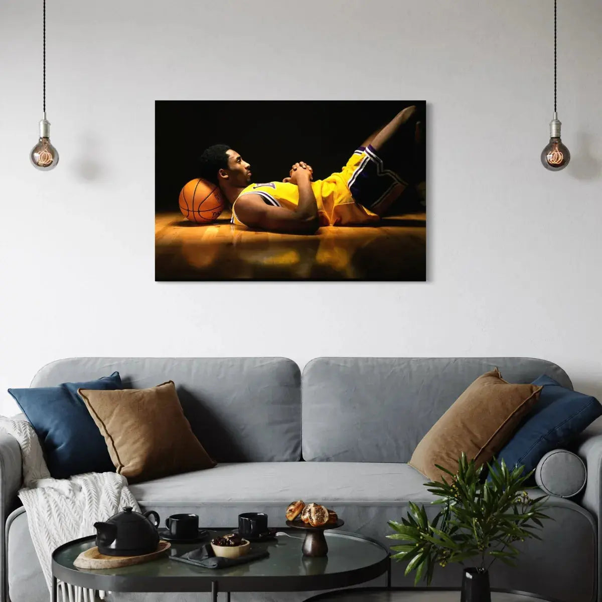 Centered wall mockup featuring artwork of a basketball player in a yellow jersey reclining on a hardwood floor with the ball as a pillow.