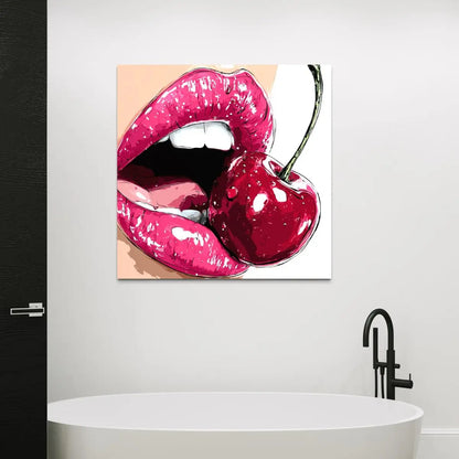 Canvas print of pink lips and a cherry on a wall above a bathtub.
