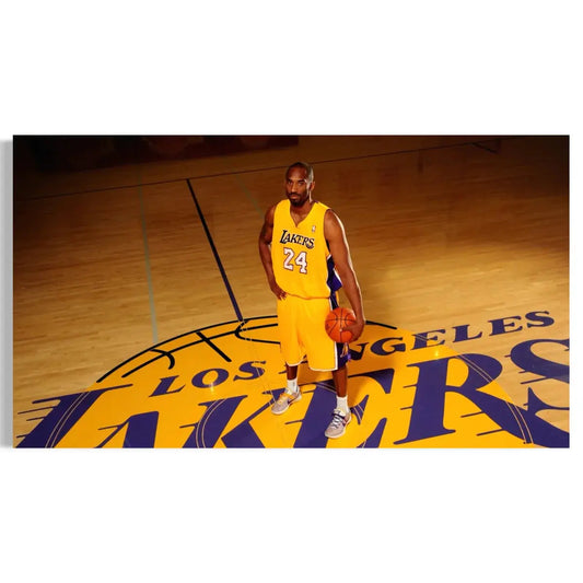 Basketball player in a Los Angeles Lakers uniform holding a basketball on a court.