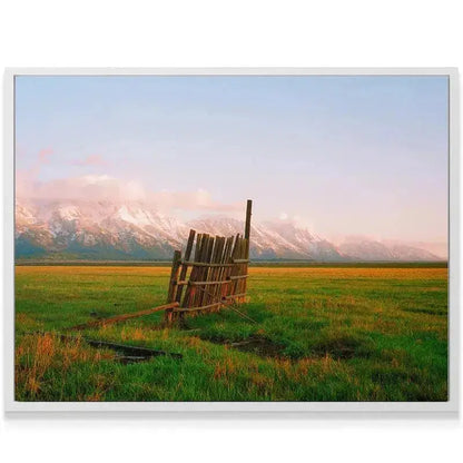Panoramic landscape featuring A Fence in Jackson centered in the expansive green and golden meadow.