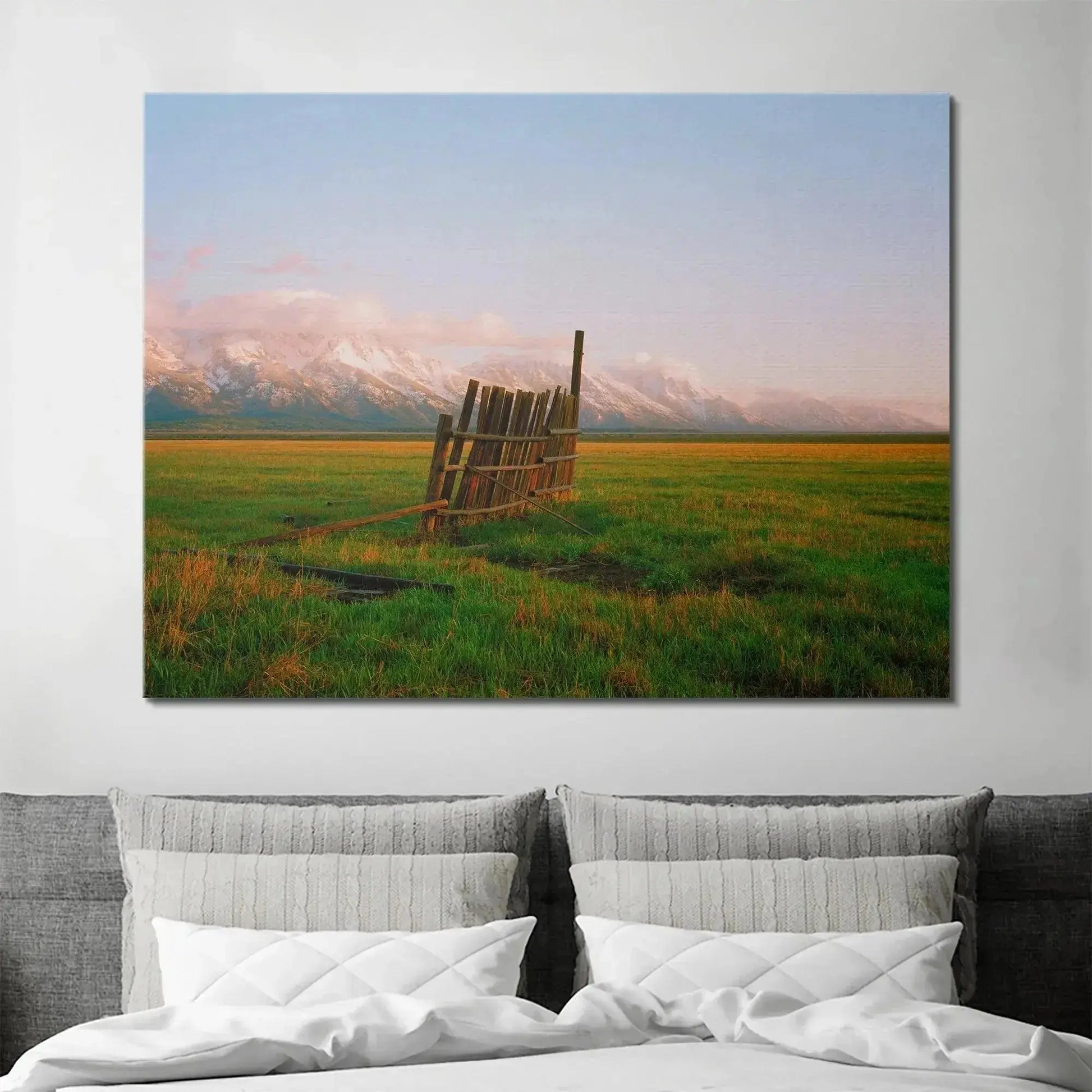 Detail shot showing the broken sections of A Fence in Jackson nestled among vibrant green grasses.