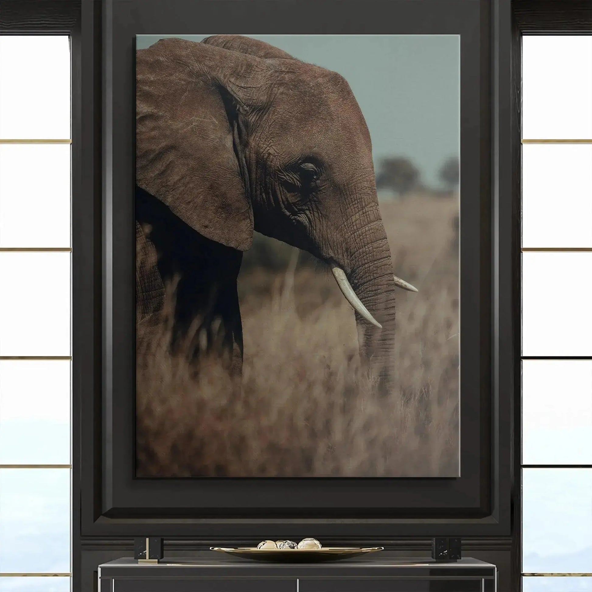 Elephant standing in tall, dry brown grass foreground, defining the mood of the unique 'A Tall Moment' photograph.