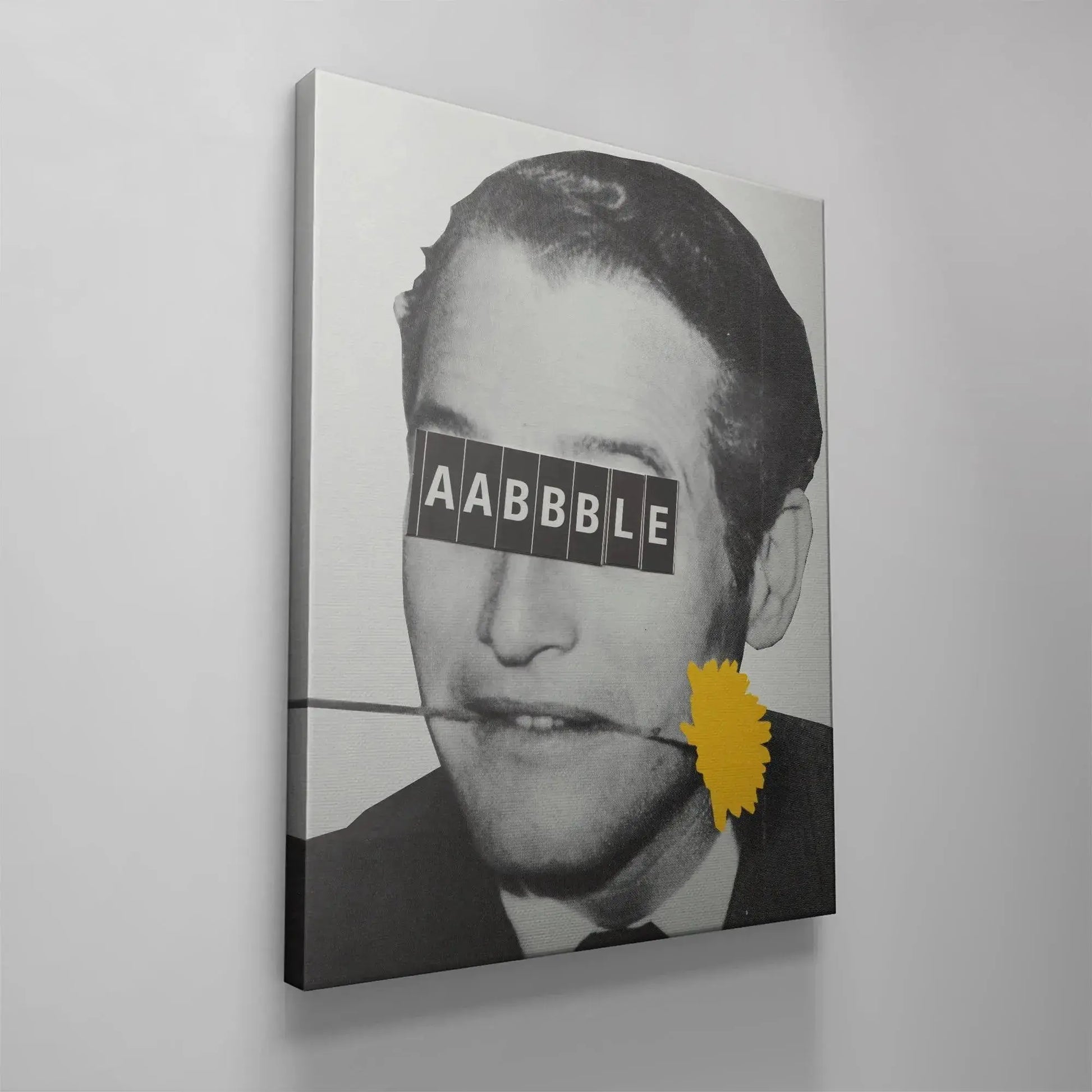 The bold yellow graphic contrasting sharply against the black and white subject of Aabbble art.