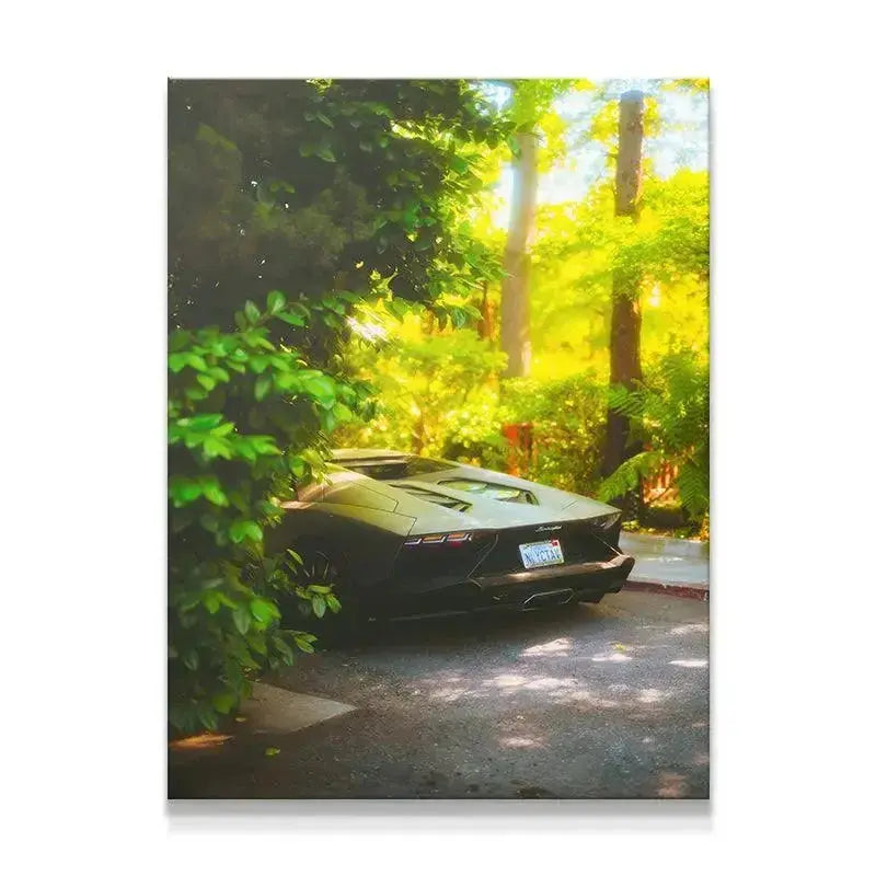 Rear three-quarter view of the sleek body lines of the Abandoned Lamborghini Aventador hidden by vibrant green trees.