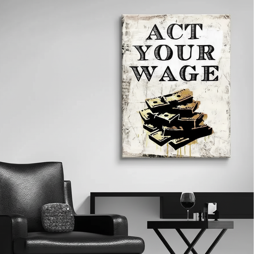 Large Act Your Wage artwork hanging on a grey wall in a contemporary living room.
