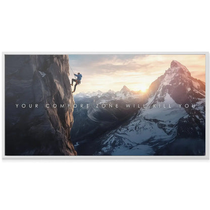 Wide landscape shot of the snow-capped peaks and valley below the climber, defining the atmosphere of 'Action Sports - Comfort Zone'.