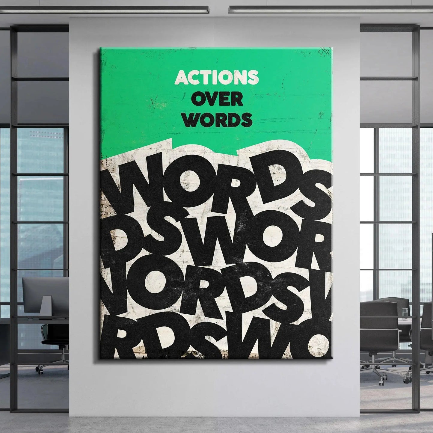 Slight angled view of the framed 'Actions Over Words' wall art displayed in a bright room.
