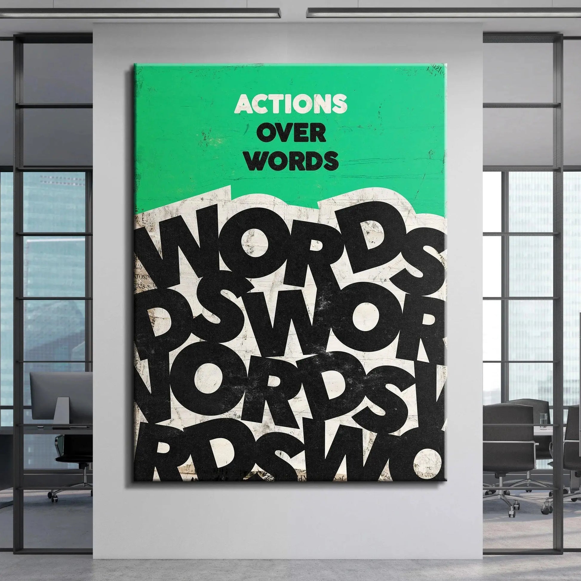 Slight angled view of the framed 'Actions Over Words' wall art displayed in a bright room.