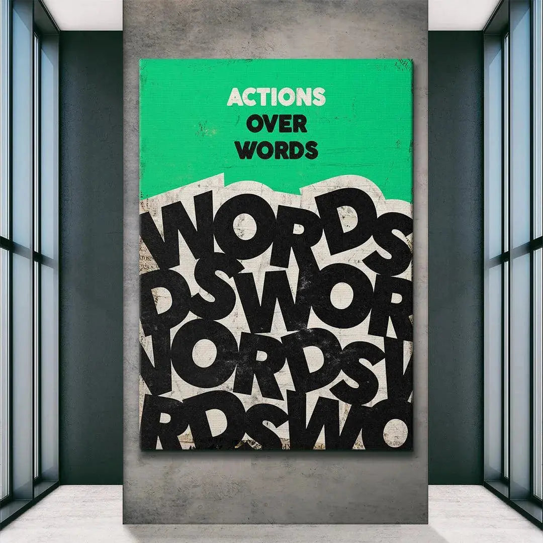 Lifestyle shot featuring the 'Actions Over Words' print displayed prominently in a minimalist home office setting.
