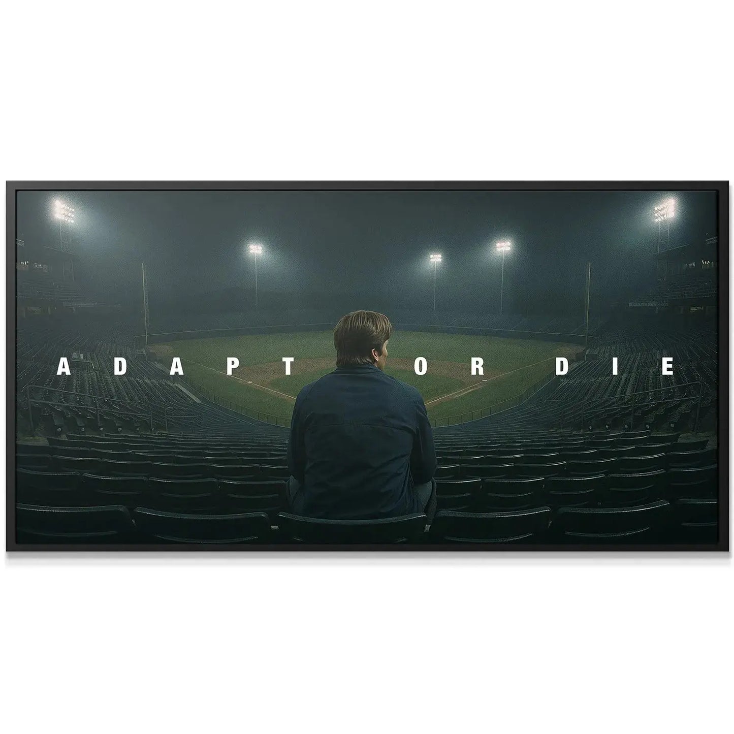 Detail view of the bold typography spelling out 'Adapt Or Die' illuminated by misty stadium lights.