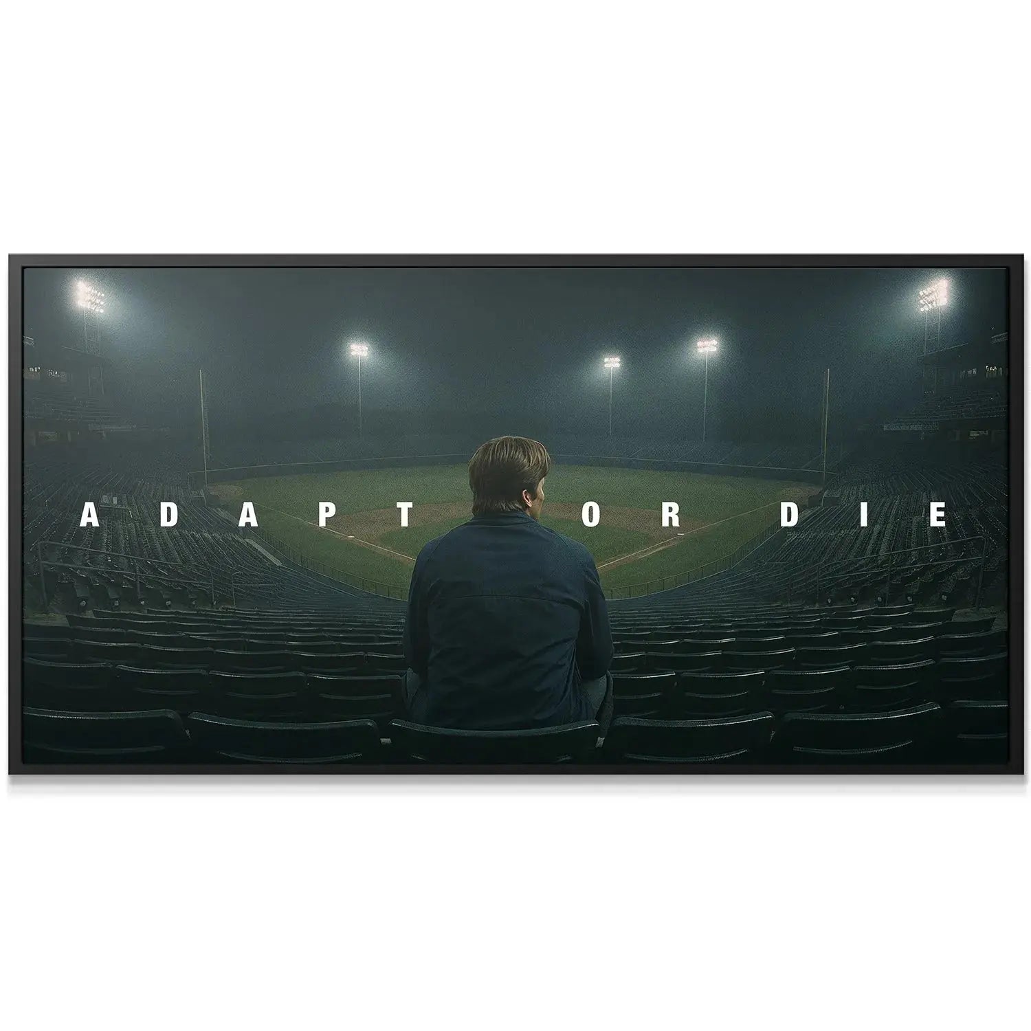 Detail view of the bold typography spelling out 'Adapt Or Die' illuminated by misty stadium lights.