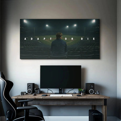 Lifestyle image of the 'Adapt Or Die' poster framed and displayed in a modern, minimalist office environment.