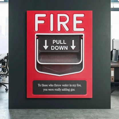 Lifestyle shot of the Add Gas fire alarm poster mounted prominently in a modern, minimalist office workspace for daily inspiration.