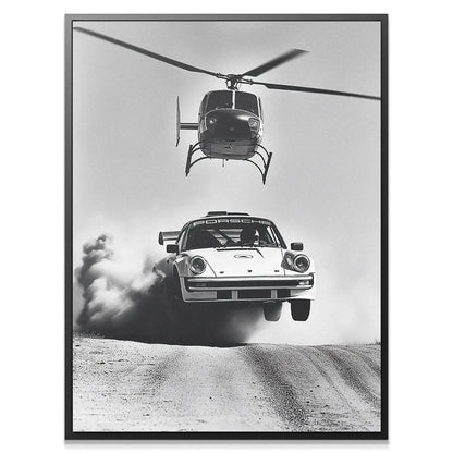 Detail close-up of the rear wheel smoking and kicking up dirt in this Air vs Land rally photo.