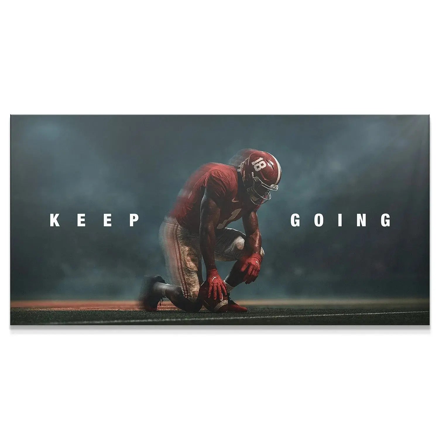 Close-up view of the kneeling football player's helmet and number 18 in the 'Alabama - Keep Going' motivational artwork.