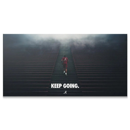 Full view of the inspirational 'Alabama - Keep Going - Stairs' poster showing the runner and text.