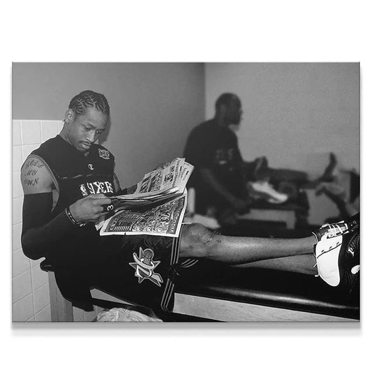 Full view: Black and white photograph titled 'Allen Iverson - Headlines' showing AI seated and reading a newspaper on a bench.