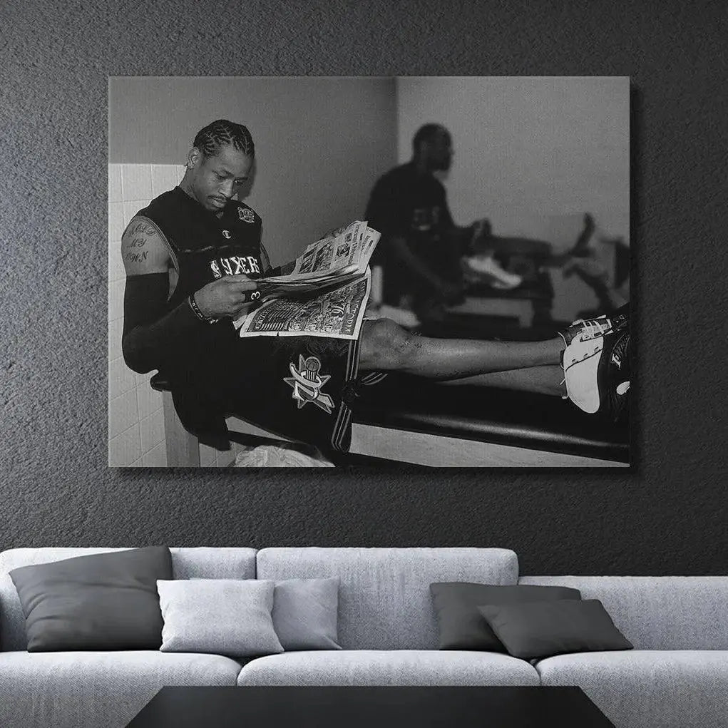 Detail of sneakers: Close-up on Allen Iverson's legs and white and black sneakers resting on the bench, featured in the 'Allen Iverson - Headlines' photograph.