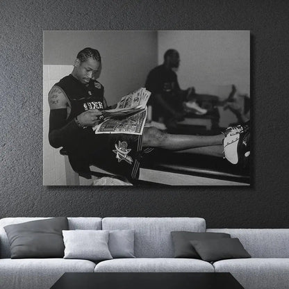 Detail of sneakers: Close-up on Allen Iverson's legs and white and black sneakers resting on the bench, featured in the 'Allen Iverson - Headlines' photograph.