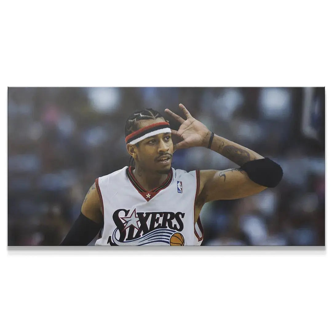 Lifestyle shot of the framed 'Allen Iverson - Prove Them Wrong' poster hanging above a modern home office desk.