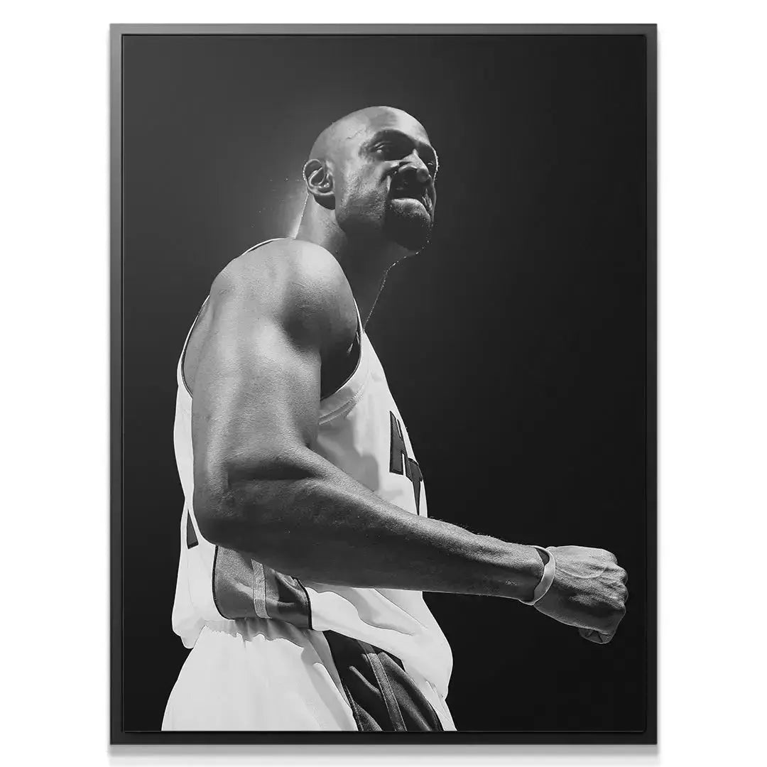 Close-up portrait of Alonzo Mourning - #1 showing his intense facial expression and determination.