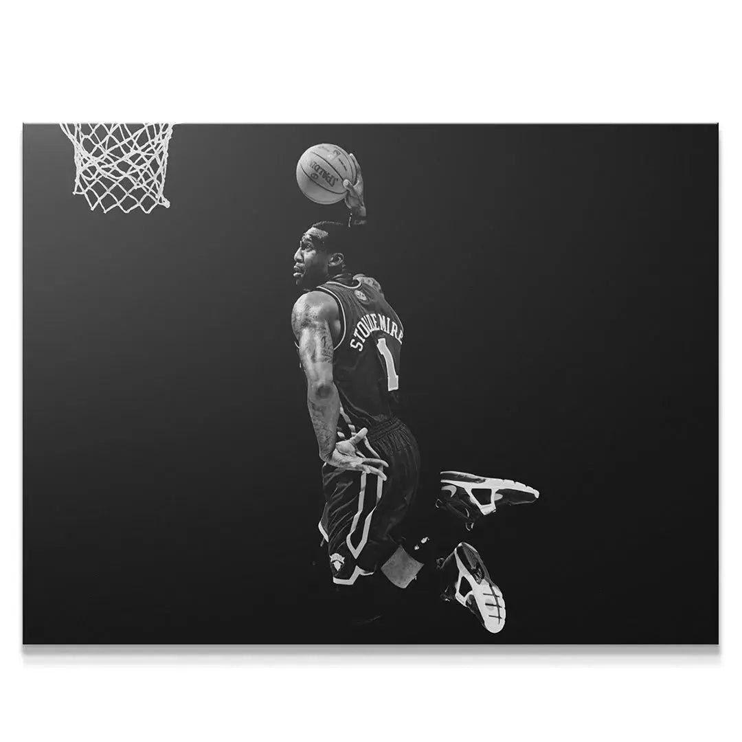 Full-body black and white action shot showing Amar'e Stoudemire - #4 suspended in air ready to score.