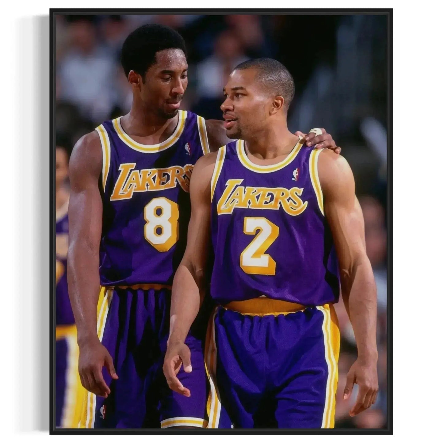 Mid-angle perspective of the two Lakers players standing shoulder-to-shoulder on the basketball court, supportive Artwork of kobe bryant.