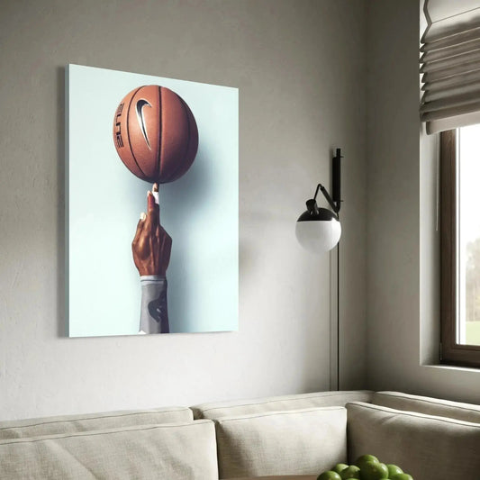 Vertical studio shot of an athletic hand wearing a grey sleeve balancing the ball against a pale blue background, part of the Basketball Wall Art – Modern Sports Print for Dynamic Interiors.