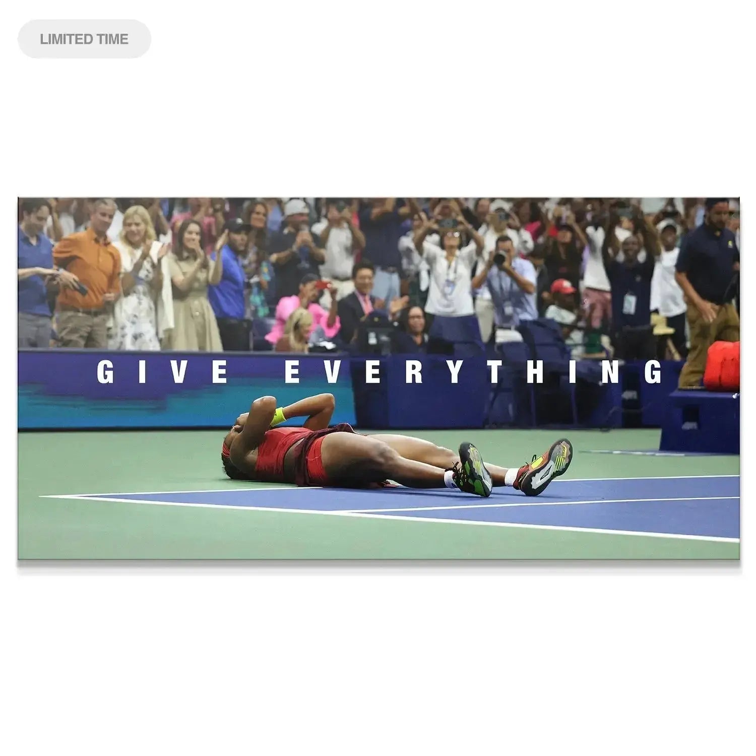 Full court view of exhausted Coco Gauff - Give Everything laying on the blue tennis surface after the final point.