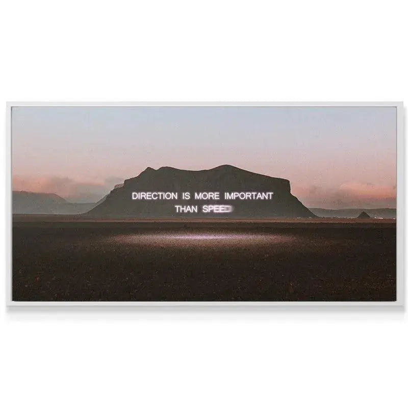 Moody sunset sky background emphasizing the powerful 'Direction' message on the motivational canvas.