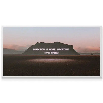 Moody sunset sky background emphasizing the powerful 'Direction' message on the motivational canvas.
