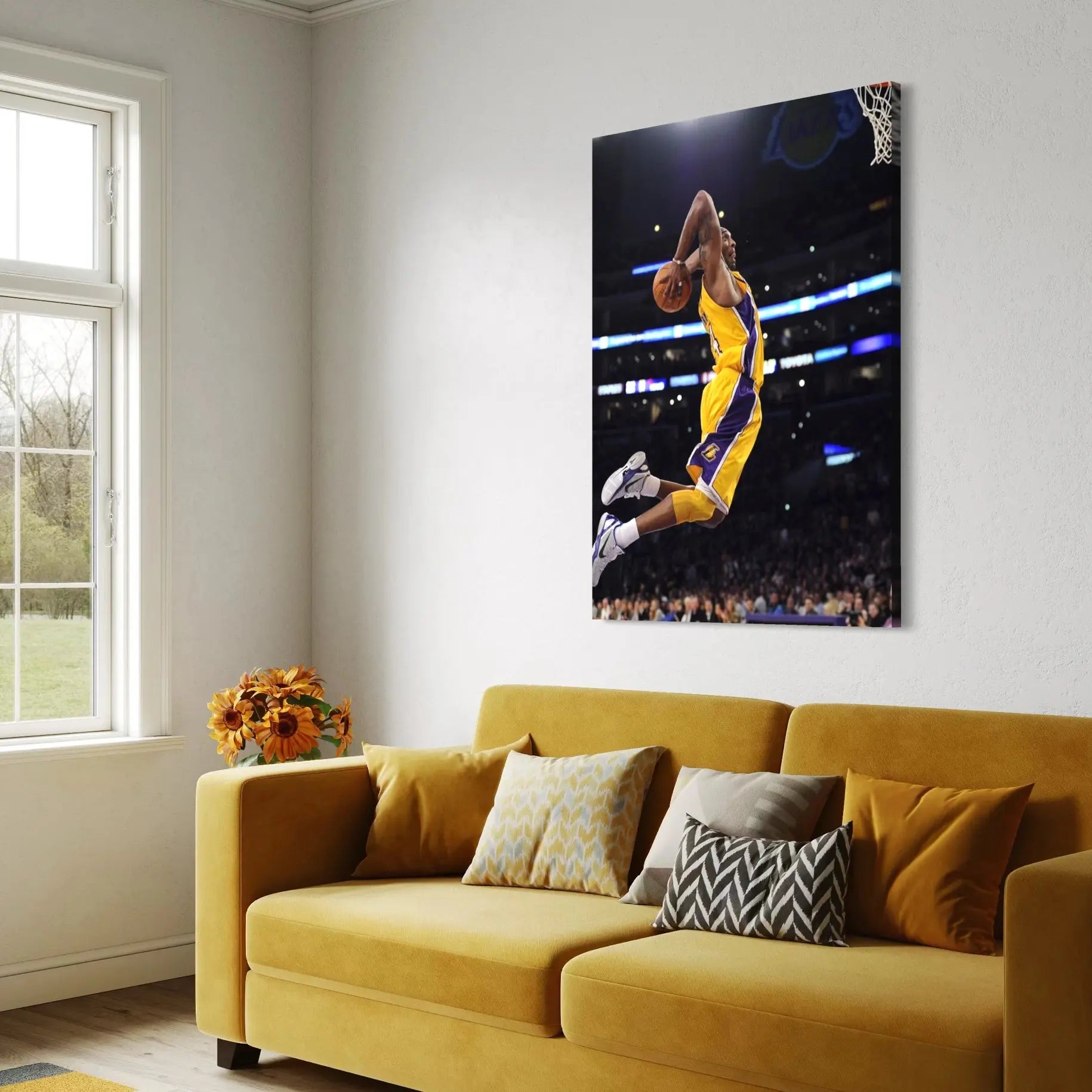 Yellow sofa in a living room with a large wall art of a basketball player in action.