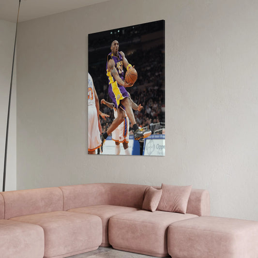 Canvas wall art of Kobe Bryant driving to the basket in his Los Angeles Lakers uniform.