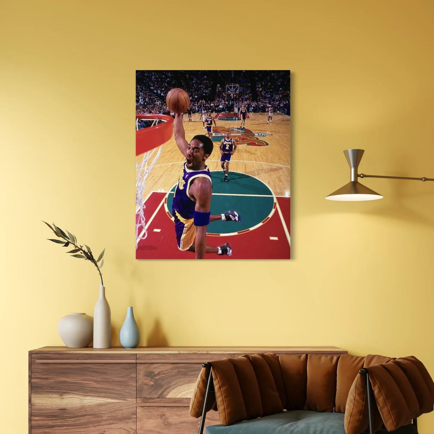 Kobe Bryant wall art showing his iconic dunk, displayed in a modern living room.