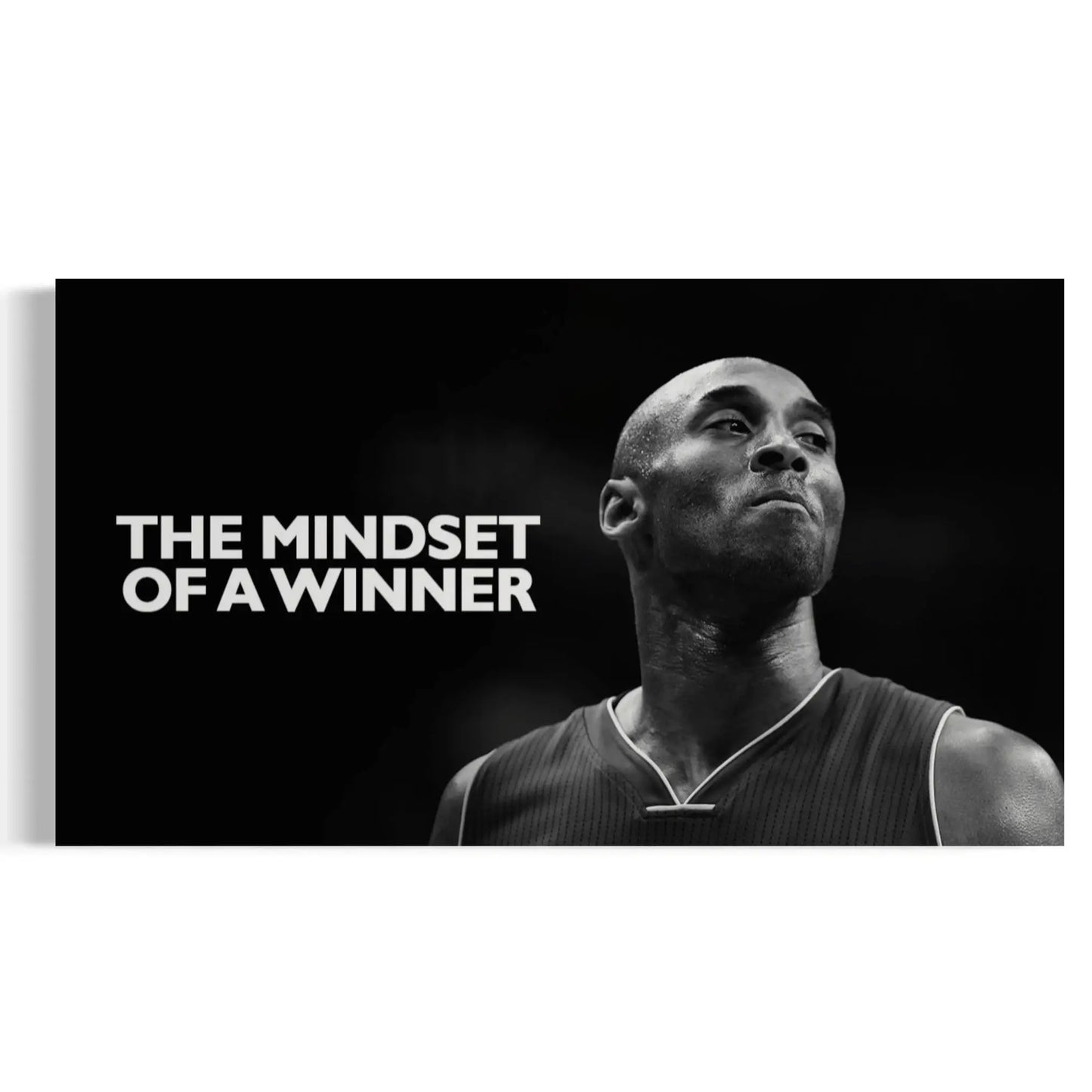 Black and white image of a basketball player with 'The Mindset of a Winner' text
