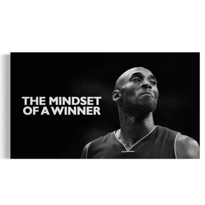 Black and white image of a basketball player with 'The Mindset of a Winner' text