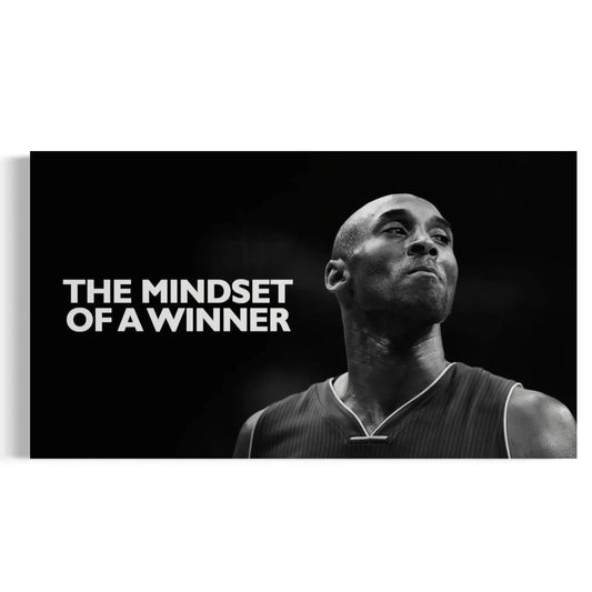 Black and white image of a basketball player with 'The Mindset of a Winner' text