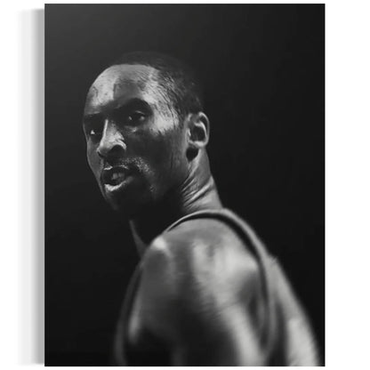 Black and white portrait of a person against a dark background