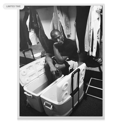 Wide shot perspective of Kobe Bryant - On Ice emphasizing the dark, private locker room environment.